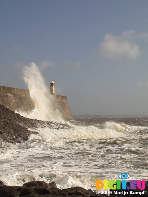 SX10176 Big wave onto lighthouse on harbour wall at Porthcawl point